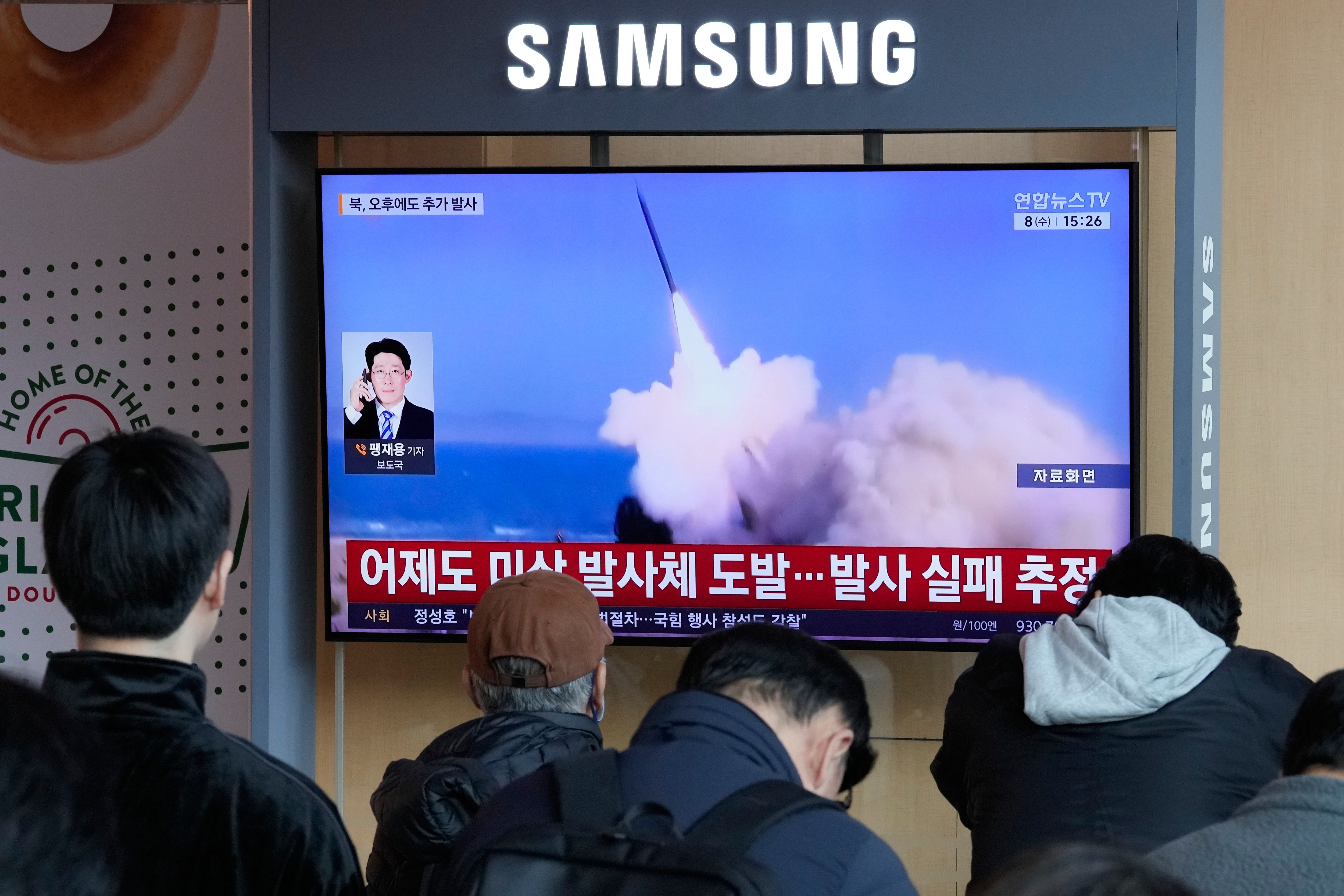 A TV screen shows a file image of North Korea